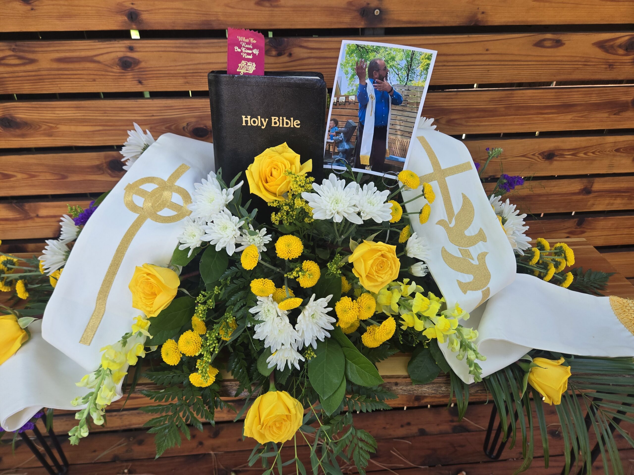 Personal items incorporated into floral tribute