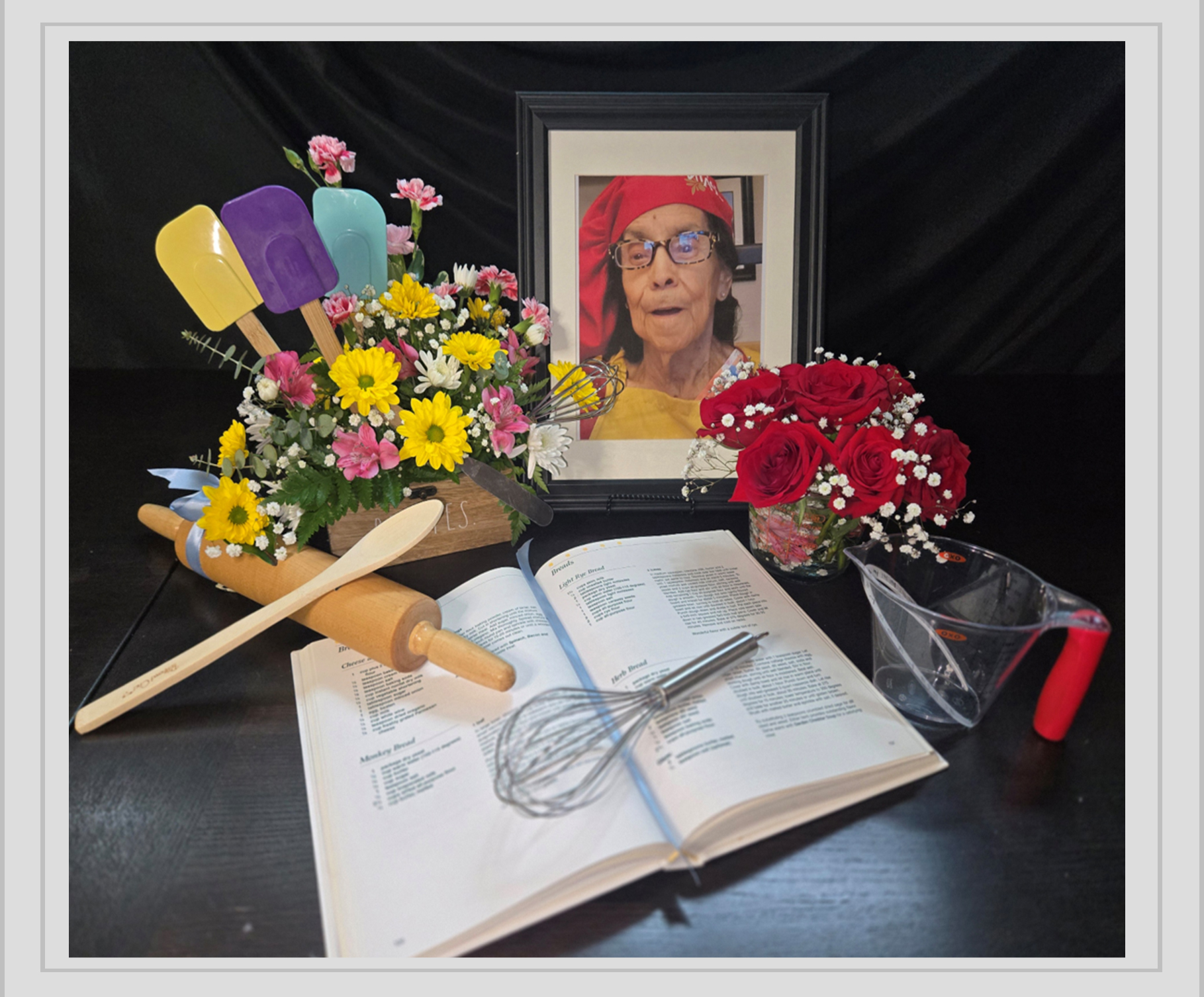 Floral arrangement with cookbook and keepsakes